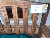 Close-up of wooden slatted backrest showing construction, finish and MaxSold tag