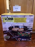 Photo of boxed Lodge cast iron skillet set showing product details and packaging.