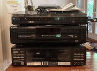 Front view showing all three stereo components stacked: BSR turntable on top, Sony 5-disc CD changer in middle, TEAC V-900X cassette deck on bottom.