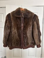 Front view of vintage fur and leather bomber jacket