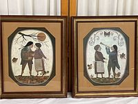 Pair of R. Davey framed prints shown together, rectangular wooden frames with octagonal matted prints depicting folk art scenes