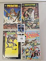 Four bagged and boarded comic books including Predator The Bloody Sands of Time #1 and #2, Spawn #1, X-Men Special Edition #1.