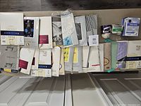 Overview of assorted vintage pantyhose packages and boxes arranged in rows showing variety of brands and styles.