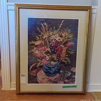 Full view of the framed print showing floral arrangement in vase on a table, visible artist signature and numbering.