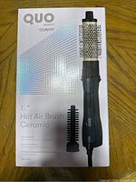 Box showing the Q Beauty by Conair 1.5 inch ceramic hot air brush and accessories