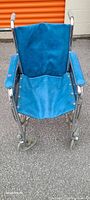 Front view of the wheelchair showing blue seat, armrests, and chrome frame.