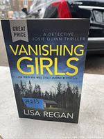 Front cover of Vanishing Girls book by Lisa Regan showing title, author, and cover art