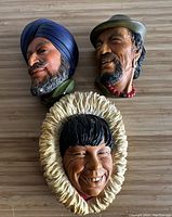 All three vintage Bossons ethnic bust wall plaques shown together on flat surface, revealing sizes and colors.