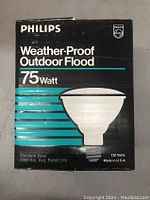 Front of a Philips boxed 75 watt weatherproof outdoor flood bulb showing product details and branding.