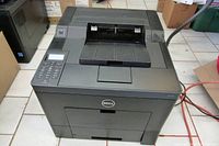 Front and top view of Dell C3760dn black laser printer showing numeric keypad, display and paper tray.