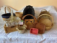 Image showing a variety of wicker and rattan baskets of different sizes and colors arranged together