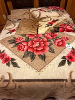 Three photos show floral fleece coverlets with red and pink flowers on a beige background, draped on a bed.