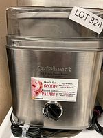 Front view of Cuisinart ice cream maker showing stainless steel body, front dial and brand logo.