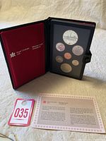 Full view of the 1984 Canadian proof set in protective case with certificate and auction tag