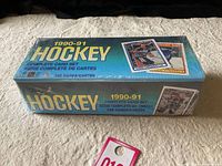 Photo of the full unopened and sealed box showing the lot as a complete 528 card set from 1990-91 season.