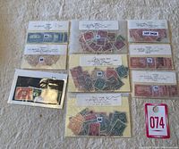 Overview of multiple envelopes and packets containing assorted used Canada stamps, each labeled with lot numbers and stamps visible through clear sleeves.