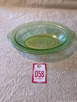 Top view of the green Depression glass oval serving bowl showing the overall shape and light green translucent color.