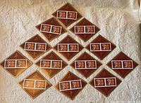 Overall view of 13 Canada Post souvenir diamond-shaped stamp sheetlets featuring Year of the Tiger stamps, arranged on a surface.