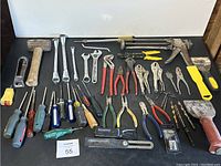 Full assortment of hand tools, grouped together showing variety and condition