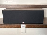 Front view of PSB 100C centre channel speaker with grille attached.
