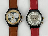 Close-up of the pair of Swatch chronographs highlighting the watch faces details and dial design