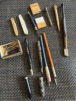 Full lot image showing antique calligraphy pens, mechanical pencils, boxes of leads, and glass cutter.