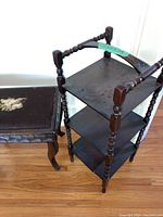 Three-tier dark wooden plant stand shelf with turned spindle legs