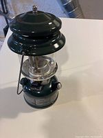 Coleman one mantle gas lantern front view on white table