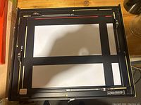 Top view of the Saunders U1417 photo graphic easel showing the rectangular frame with measurement markings and white insert sheets.
