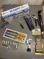Image showing full selection of tools including socket sets, chisel set, pipe cutter, ice scraper, tin snips and crowbar.