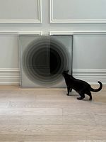 Frontal view of entire artwork with cat for scale