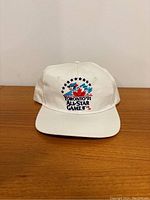 Front view of white Starter brand baseball hat with colorful 1991 Toronto Blue Jays All-Star Game embroidery showing maple leaf, baseball diamond, stars, and text.