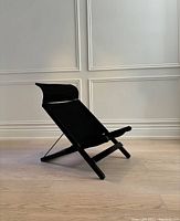 Side view of assembled chair with canvas seat and headrest attached