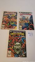 Three Marvel Comics Contest of Champions limited series issues 1-3 laid flat showing full cover artwork.