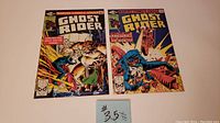 Two Ghost Rider comic books, issues #53 and #54 from 1981, placed side by side on a flat surface with a note indicating #53.