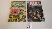 The Adventures of Kool-Aid Man No. 3 and Kull the Conqueror No. 2 Marvel Comics laid out side by side on a white surface with a lot label.