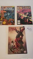 Three Marvel comic books: Blade Runner #1, Nth Man #1, Stephen King The Dark Tower 5 of 5 (The Long Road Home) shown together in protective bags.