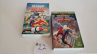 Front cover photo showing Overstreet Comic Book Price Guide numbers 21 and 22 side by side on a flat surface with a #22 paper label