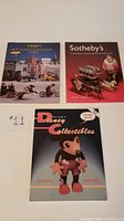 Front covers of the three books showing titles and cover images of toys and Disney figurines.