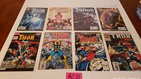 Full lot of 8 The Mighty Thor Marvel comic books laid out in two rows on a flat surface.