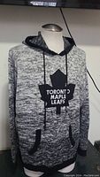 Front view of the Toronto Maple Leafs NHL hoodie showing the maple leaf logo and front pocket
