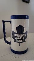 White and blue Toronto Maple Leafs mug showing logo and blue handle