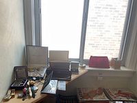 Overview of mixed costume jewelry and watches on tabletop