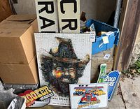 Grouped photo showing Dizzy Dean Murray plaque, Hooker Headers sign, and Railway Crossing partial signs in background.