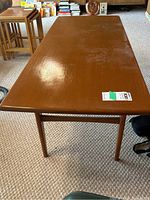 Full view of coffee table with three nesting side tables visible in background