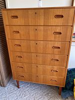 Front elevation showing all six drawers and integrated handles