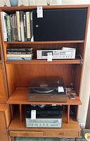 Full front view of teak media cabinet showing overall structure