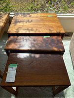 Three tables nested together showing overall set and stacking arrangement