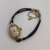 Watch shown angled front view to show dial, case, strap, and crown detail.