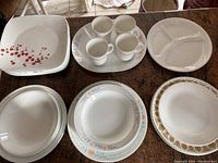 Top view of various Corelle plates and cups on countertop showing three different pattern styles.